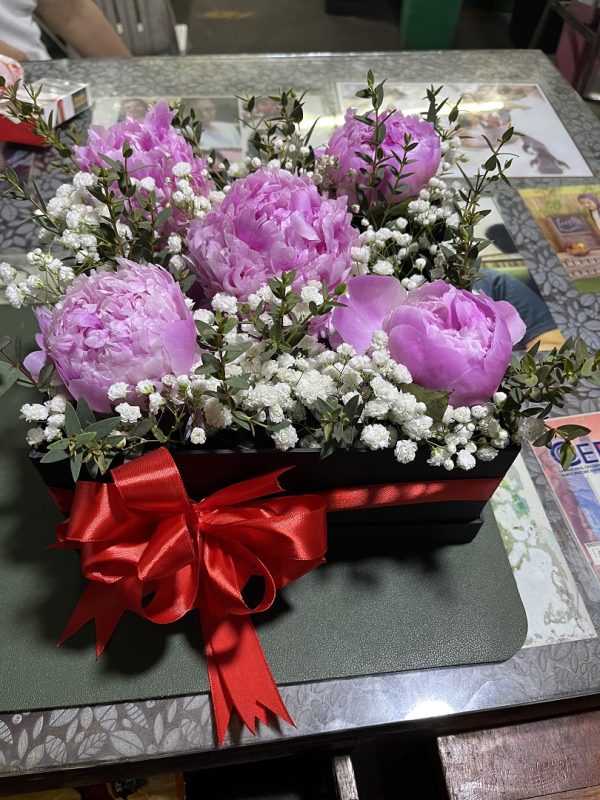 Peonies in a box